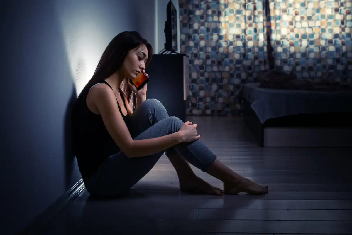 Picture of a woman calling for help for domestic violence.